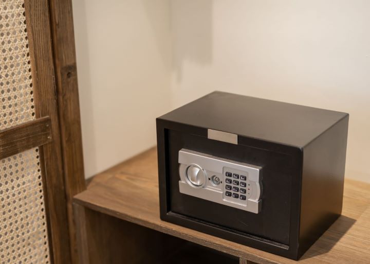 a locked safe sitting in an empty closet